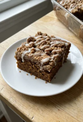 A close-up of the cinnamon crumble topping on the dark gingerbread coffee cake.