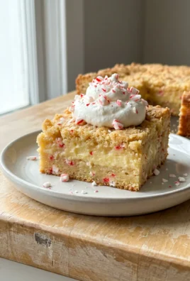 A square slice of the layered cake showing the dense bottom, custard middle, and cakey top.